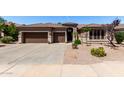 Charming single-story home featuring a three-car garage and desert landscaping at 198 N Nevada Way, Gilbert, AZ 85233