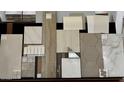 Selection of interior design materials featuring tile, wood samples, and various color swatches at 22482 S 180Th Pl, Queen Creek, AZ 85142