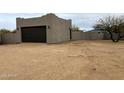 Spacious detached garage featuring a large door and ample parking space at 2427 W Desert Hills Estate Dr, Phoenix, AZ 85086