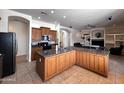 Spacious kitchen with granite counters, stainless steel appliances and tile backsplash at 2427 W Desert Hills Estate Dr, Phoenix, AZ 85086