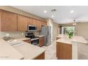 Modern kitchen with stainless steel appliances, quartz countertops, and ample cabinetry at 3239 S Tatum Ln, Gilbert, AZ 85297