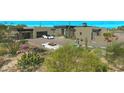 Modern home featuring beautiful desert landscaping and driveway parking at 41639 N 113Th Pl, Scottsdale, AZ 85262