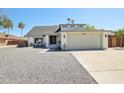 Charming single-Gathering home featuring a gravel front yard and convenient two-car garage at 4521 W Buffalo St, Chandler, AZ 85226