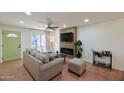 Bright living room with a green front door, modern fireplace, and stylish furniture at 5550 N 12Th St # 2, Phoenix, AZ 85014