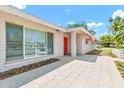 Inviting single-story home with a red front door, a walkway to the front door, and a well-kept lawn at 737 E 7Th Pl, Mesa, AZ 85203
