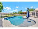Beautiful backyard pool surrounded by a secure fence and patio, perfect for relaxing and entertaining at 737 E 7Th Pl, Mesa, AZ 85203