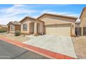 Inviting single-story home featuring a two car garage with desert landscaping at 900 W Broadway Ave # 45, Apache Junction, AZ 85120