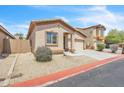 Attractive single-story home featuring a well-maintained yard with desert landscaping at 900 W Broadway Ave # 45, Apache Junction, AZ 85120