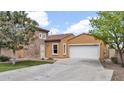 Charming single-Gathering home with a two-car garage and stone accents on a sunny day at 17132 W Tara Ln, Surprise, AZ 85388