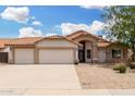 Charming home with a two-car garage, arched entry, and low-maintenance desert landscaping at 19029 N 36Th St, Phoenix, AZ 85050