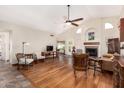 Spacious living room with vaulted ceilings, a fireplace, and hardwood floors at 19029 N 36Th St, Phoenix, AZ 85050