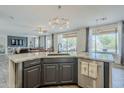 Open kitchen with granite countertops, dark cabinetry, and stainless steel appliances, perfect for cooking at 2210 W Calle Del Sol --, Phoenix, AZ 85085