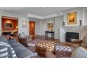 Elegant living room with a fireplace, stylish seating, and a decorative rug at 2402 E Esplanade Ln # 1101, Phoenix, AZ 85016