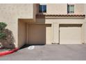 Image of a home's garages and covered parking with desert landscape and rock details at 3441 N 31St St # 118, Phoenix, AZ 85016
