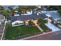 Aerial view showcasing a home with a pool, spa, lush greenery, and modern architecture at 3653 E Highland Ave, Phoenix, AZ 85018