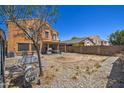 An expansive backyard with a covered patio and low maintenance landscaping, great for entertaining at 40437 W Robbins Dr, Maricopa, AZ 85138
