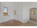 Bright entryway with neutral-toned walls, tiled flooring, and modern decor at 4222 E Torrey Pines Ln, Chandler, AZ 85249