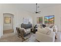 Spacious living room with vaulted ceilings, neutral color palette, and ample natural light at 4222 E Torrey Pines Ln, Chandler, AZ 85249