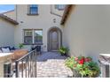 Inviting front porch seating area with comfortable furniture and decorative potted plants at 4700 S Fulton Ranch Blvd # 62, Chandler, AZ 85248