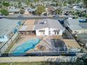 Bird's eye view of backyard with pool, patio, and surrounding residential neighborhood at 5407 W Cambridge Ave, Phoenix, AZ 85035
