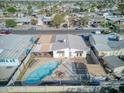 Aerial image showing a pool, patio, and fenced backyard in a residential area at 5407 W Cambridge Ave, Phoenix, AZ 85035