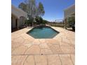 Luxurious pool area with flagstone patio and a play area in the backyard at 9267 E Rimrock Dr, Scottsdale, AZ 85255