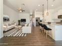 Open-concept living room featuring modern furnishings and a seamless transition to the kitchen at 10531 E Nopal Ave, Mesa, AZ 85209
