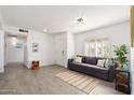 Comfortable living room with tiled floors, neutral colors, and bright natural light, a cozy and inviting space at 15212 N 53Rd St, Scottsdale, AZ 85254