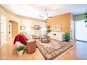 Comfortable living room with lots of natural light, hardwood floors, and a neutral color palette at 17225 N 51St Dr, Glendale, AZ 85308