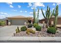 A beautiful house with desert landscaping features various cacti and native plants at 1788 W Dion Dr, Anthem, AZ 85086