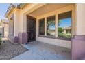 Inviting front porch with decorative security door and views of the neighborhood at 18003 W Carmen Dr, Surprise, AZ 85388
