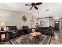 Inviting living room with vaulted ceilings, stylish decor, and comfortable seating at 18016 N 145Th Ave, Surprise, AZ 85374