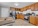 Functional kitchen with wooden cabinets, stainless steel appliances, and ample counter space at 1815 E Illini St, Phoenix, AZ 85040