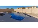 Beautifully designed backyard pool with desert landscaping, offering a private oasis at 18414 W La Mirada Dr, Goodyear, AZ 85338