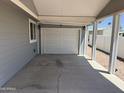 Spacious carport with a secure garage door and ample parking, offers shade and protection from the elements at 201 S Greenfield S Rd # 222, Mesa, AZ 85206