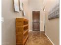 Welcoming entryway featuring tile flooring, decor, and a dark wood front door at 291 E Canyon Rock Rd, San Tan Valley, AZ 85143
