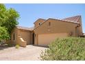Charming single-story home with a two-car garage and desert landscaping at 291 E Canyon Rock Rd, San Tan Valley, AZ 85143