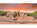 Charming desert home featuring adobe construction, desert landscaping, and a brick pathway at 29619 N 142Nd Pl, Scottsdale, AZ 85262
