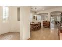 Bright dining room with modern decor and a view into the adjacent living spaces at 3038 W Trapanotto Rd, Phoenix, AZ 85086