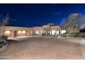 Stunning home with a circular driveway, desert landscaping, and an attached three-car garage at 30600 N Pima Rd # 81, Scottsdale, AZ 85266
