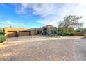 This home features a large paver driveway and mature desert landscaping at 30600 N Pima Rd # 81, Scottsdale, AZ 85266