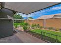 Inviting covered patio and fenced yard, perfect for entertaining and relaxation at 3284 E Sandy Way, Gilbert, AZ 85297