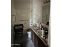 Standard bathroom features a shower/tub combo, single sink vanity, and accessible grab bars at 3556 E Helena Dr, Phoenix, AZ 85032
