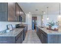 Modern kitchen featuring granite countertops, stainless steel appliances, and tile flooring at 4150 S Neutron --, Mesa, AZ 85212