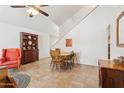 Eat-in dining room with a ceiling fan, a built-in hutch and a wooden table with chairs at 440 N New Hvn, Mesa, AZ 85205