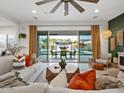Bright living room featuring stylish decor, a large sliding glass door with views of the backyard at 5457 S Benton --, Mesa, AZ 85212