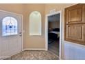 Inviting entryway featuring neutral walls, decorative niche, and view to a bedroom at 650 N Hawes Rd # 2827, Mesa, AZ 85207