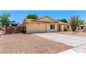 A well-maintained single-story home featuring desert landscaping and an attached two-car garage at 6533 E Kelton Ln, Scottsdale, AZ 85254