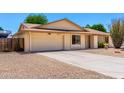 A well-maintained single-story home featuring desert landscaping and an attached two-car garage at 6533 E Kelton Ln, Scottsdale, AZ 85254