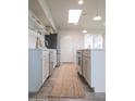 Contemporary kitchen featuring modern appliances, open shelving, and a seamless design that leads to the backyard at 7802 E Kimsey Ln, Scottsdale, AZ 85257